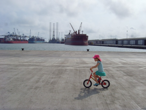 Our daughter cycling on the new pier in the Port of Tema, Ghana, 2016